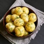 Lush backyard vegetable gardens brimming with fresh produce and vibrant flowers