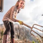 Illustration of a thriving IFAS vegetable container garden with various plants and colorful harvests
