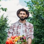 Companion planted container vegetable garden with diverse mix of plants for successful container gardening