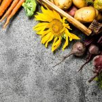 Colorful flowers like marigolds attract beneficial insects to help veggies thrive in garden